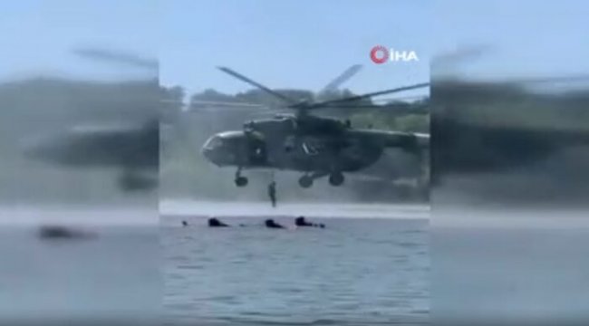 Ukrayna'da askeri helikopter tatilcilerin arasında tatbikat yaptı