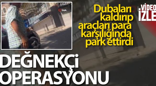 Dubaları kaldırıp araçları para karşılığında park ettiren değnekçi kamerada