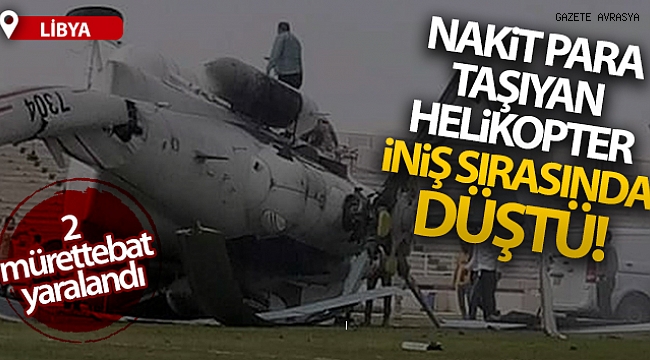 Libya'da nakit para taşıyan helikopter iniş sırasında düştü.