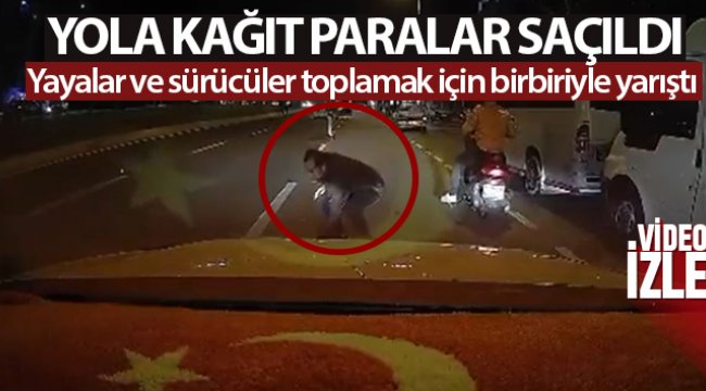 Yola kağıt paralar saçıldı, yayalar ve sürücüler toplamak için birbiriyle yarıştı