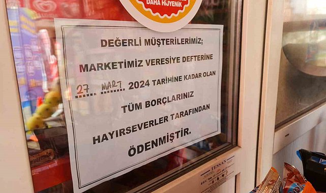 Hayırsever, bakkalın veresiye defterindeki borçları ödedi