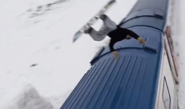 Snowboardla Doğu Ekspresi'nin üzerinden atladı