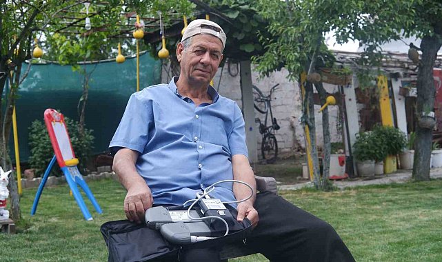 Çantasında taşıdığı yapay kalp cihazıyla hayatını sürdürüyor