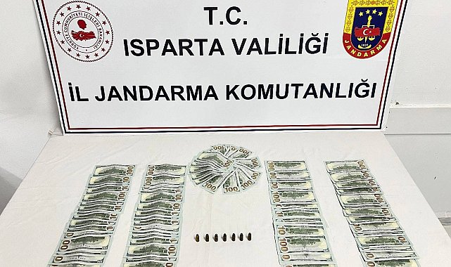 Isparta'da piyasaya sahte dolar sürmek üzere olan 3 şahıs yakalandı